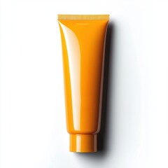 Yellow cosmetic tube on white background for skincare or beauty product advertisement