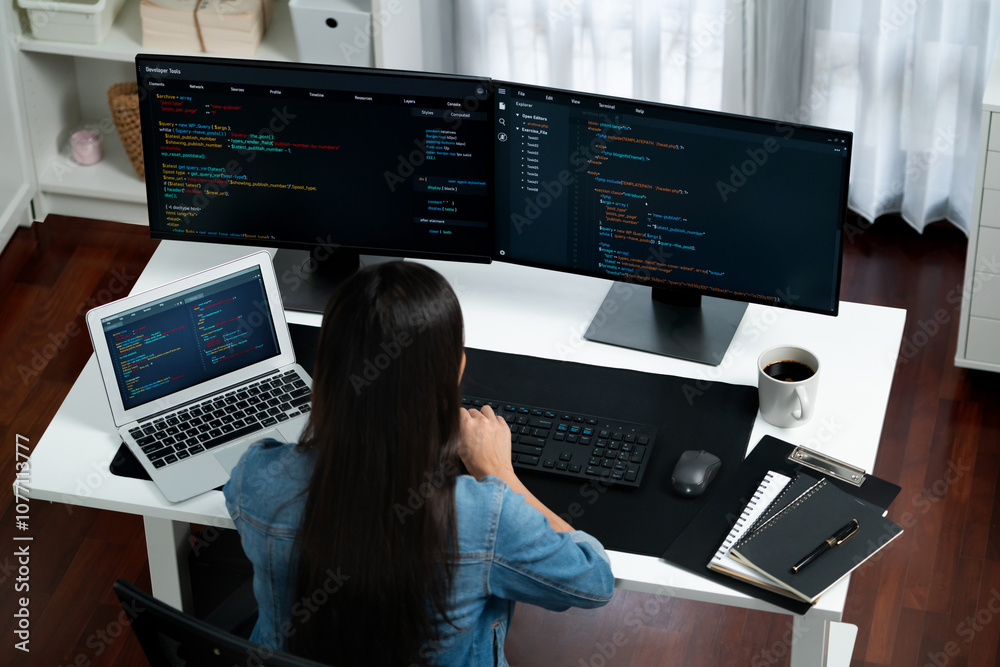 Poster top view young asian it developer creating with typing online information on pc with coding program 
