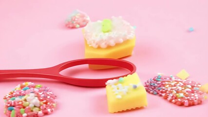 playful holiday concept featuring red toothbrush toothpaste decorated colorful sugar sprinkles set pink background video ideal New Year’s Christmasthemed dental alth awareness campaigns sprinkle