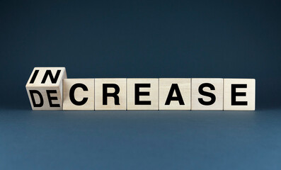 Wooden blocks spelling out INCREASE and DECREASE