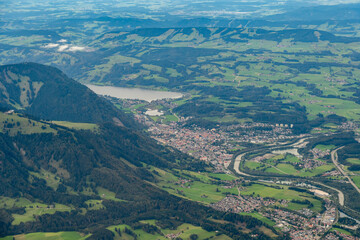 Sonthofen area with snow covered mountains seen from a small plane