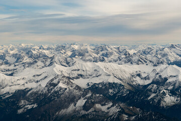 Sonthofen area with snow covered mountains seen from a small plane