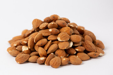 Raw Almonds Pile on White Background
