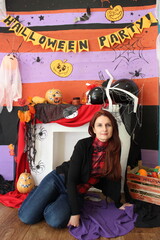 Fototapeta premium girl, woman, animator, costume, Halloween, children's center, smiling, decorations, pumpkins, ghosts from balloons, artificial flowers, birthday, holiday, birthday, holiday, circus
