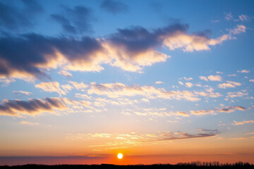 Sunset sky background. Blue sky with golden light and clouds with soft blur motion effect backgrounds.
