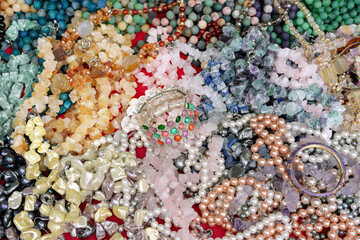 Beads and necklaces made of precious and semi-precious stones. Jewelry background.