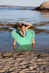 Dancer in shallow ocean water