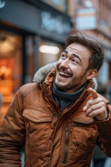 Obraz premium A happy man wearing a brown jacket smiles at the camera