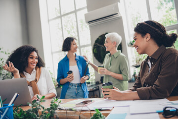 Photo of lovely four businessladies feminist meeting share ideas have fun chatting spend break time...