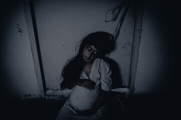 Portrait of asian woman make up pregnant ghost.,Scary horror scene for background,Halloween...