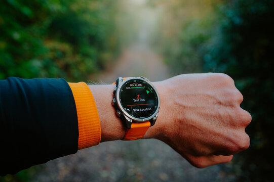 New Garmin Watch Garmin Fenix 8, modern Wath 47 mm with amoled display on hand of Trail Runner before the Morning Trail Run