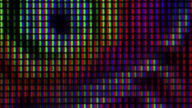 Close up view of IPS LCD screen pixels texture. Macro shot of computer monitor. Abstract colorful background.
