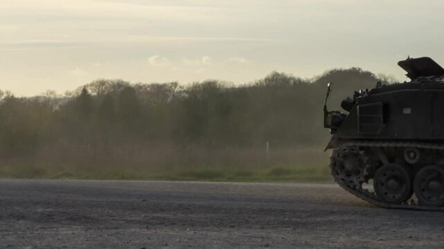 British army FV434 mechanized Armoured Repair Vehicle and Bulldog FV432 in motion on a military exercise, Wilts UK