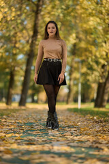 Latin lady in a colorful park in the autumn
