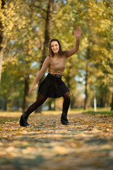 Latin lady in a colorful park in the autumn
