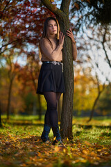 Latin lady in a colorful park in the autumn