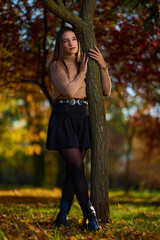 Latin lady in a colorful park in the autumn