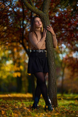 Latin lady in a colorful park in the autumn