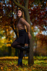Latin lady in a colorful park in the autumn
