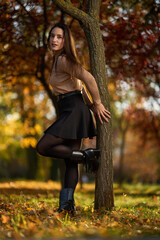 Latin lady in a colorful park in the autumn