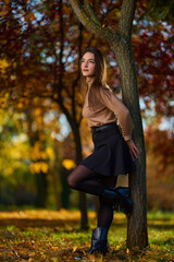 Latin lady in a colorful park in the autumn