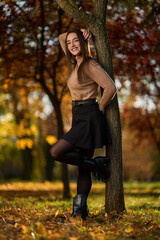 Latin lady in a colorful park in the autumn