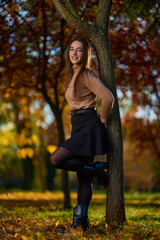Latin lady in a colorful park in the autumn