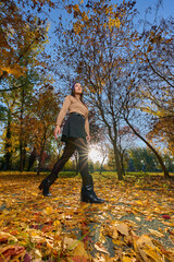 Latin lady in a colorful park in the autumn