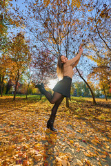 Latin lady in a colorful park in the autumn