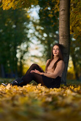 Latin lady in a colorful park in the autumn