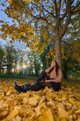 Latin lady in a colorful park in the autumn