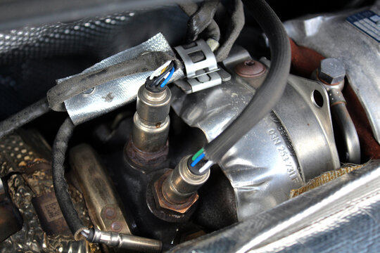 Vinnytsia, Ukraine; October 26, 2024. Volkswagen Tiguan lambda probe and oxygen sensor. Volkswagen Tiguan engine turbine. Diesel engine parts close up.