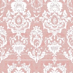 a close up of a pink and white lace pattern