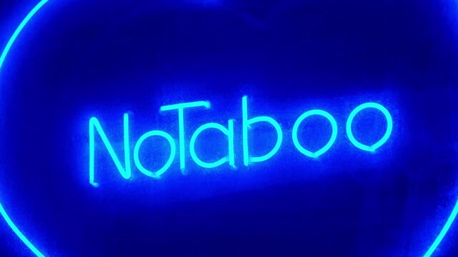 No Taboo inscription in blue color at sex shop window. Peccability and moral degradation of society, decline in morals