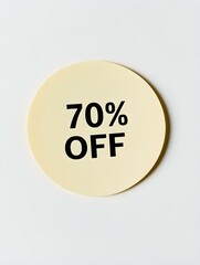 Black '70% OFF' Text on a Light Yellow Round Paper Note. White Background 