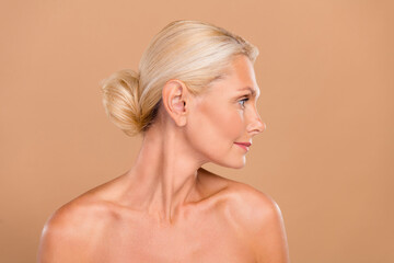 Photo of sweet dreamy nude lady wear nothing looking empty space isolated beige color background
