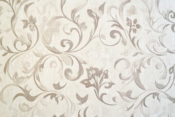 Vintage wallpaper with a brocade texture and flowing lines.