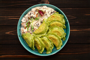 Dumplings with spinach and mushrooms with sauce