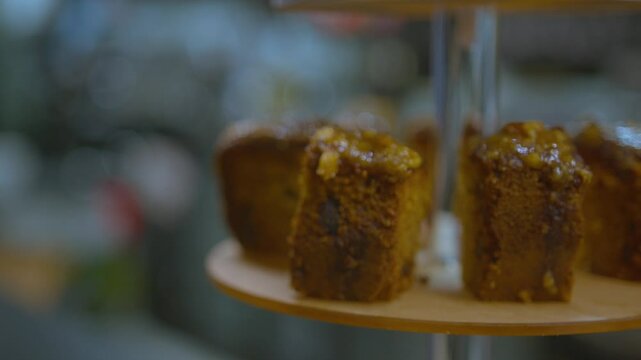Professional organising slices of cake on a display tower