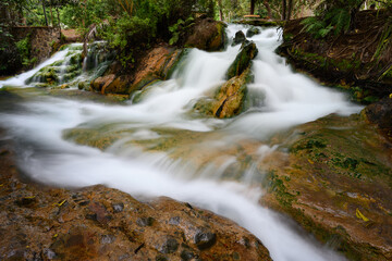 Soa Hot Spring Waterfall in Mangeruda, Flores, Indonesia with Thermal Water Flowing over Rocks