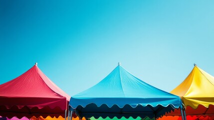 Brightly colored tents against a vibrant blue sky, creating a playful and lively atmosphere reminiscent of a joyful festival.
