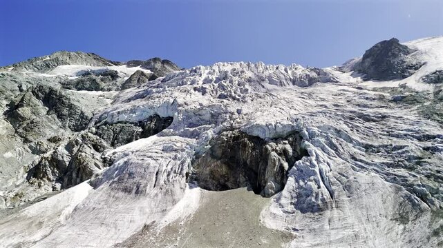 Aerial view of the Moirie Glacier in Switzerland showing its icy melting surface.