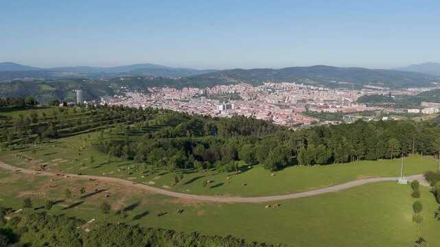 Aerial footage of Mount Cobetas with a view over Bilbao city in the province of Biscay, Spain