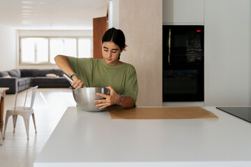 Mixing Ingredients in Kitchen