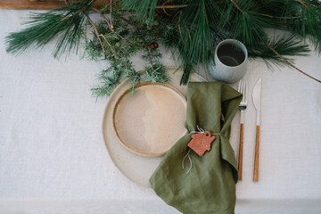 Rustic table setting with green napkin and a natural vibe
