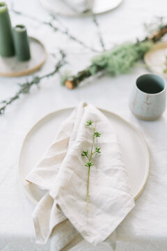 Simple but elegant table setting with natural accents.