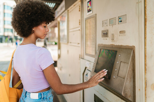 Student Buying Ticket at Machine