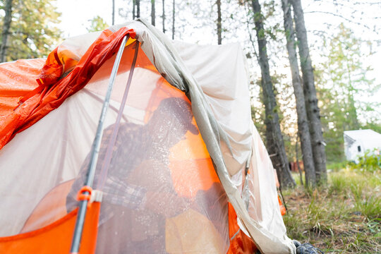 Senior man inside camping tent