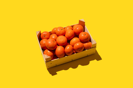 Orange citrus fruits in crate