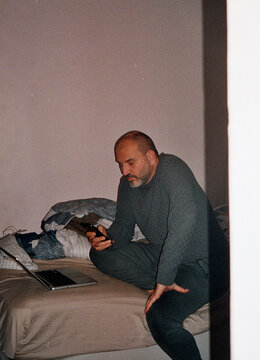 Man in Gray Pajamas Browsing